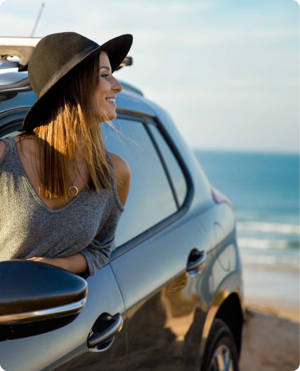 Tourist enjoying a rental car